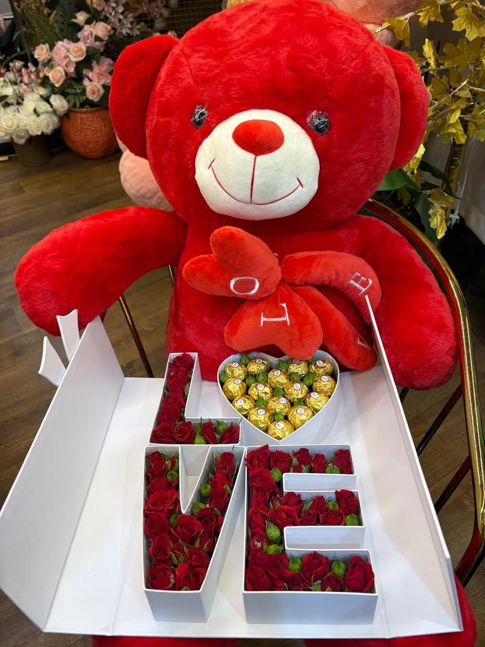 Valentine gift set with a large red teddy and LOVE-shaped rose and chocolate box