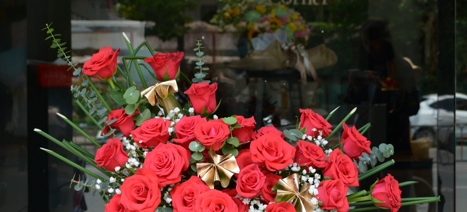 Deep red rose arrangement used as a decorative event background